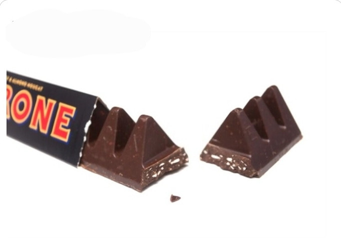 شکلات تلخ با مغز عسل و نوقای بادام تابلرون Tobleroneوزن ۱۰۰گرم